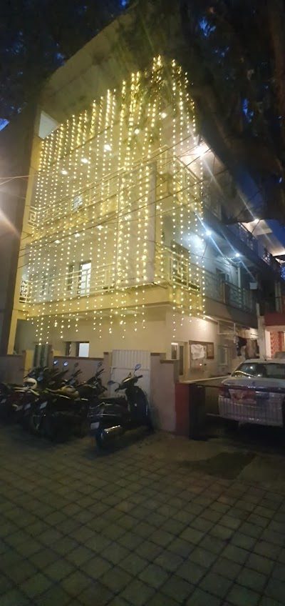 The Beehive Hostel — the building lit up in the evening