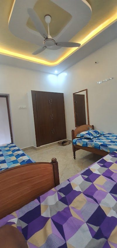 The Beehive Hostel — three-sharing room with wardrobe and mirror