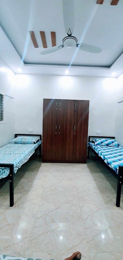 The Beehive Hostel — twin sharing room with wardrobe